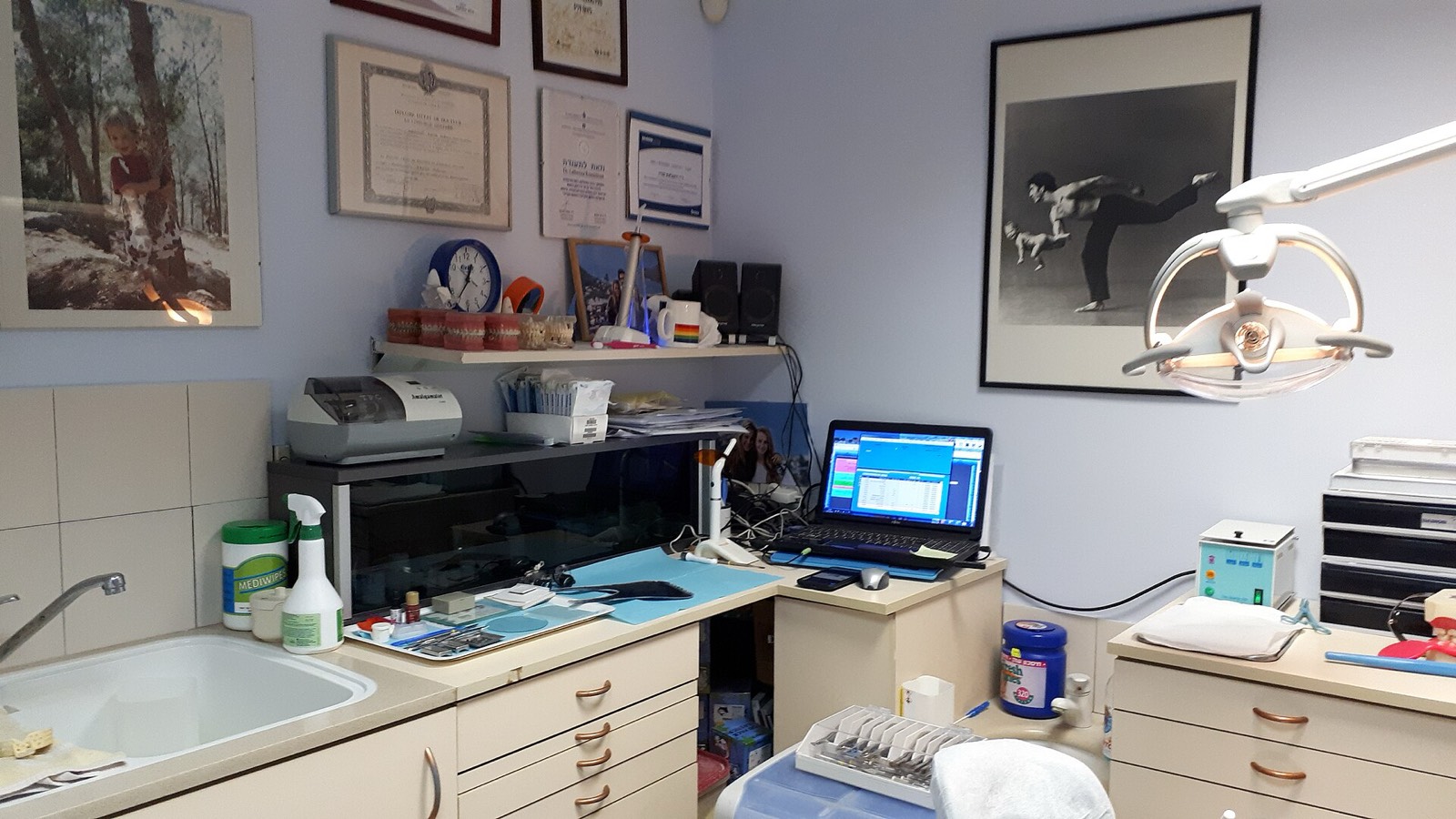 A bright dental treatment room with a chair and a window