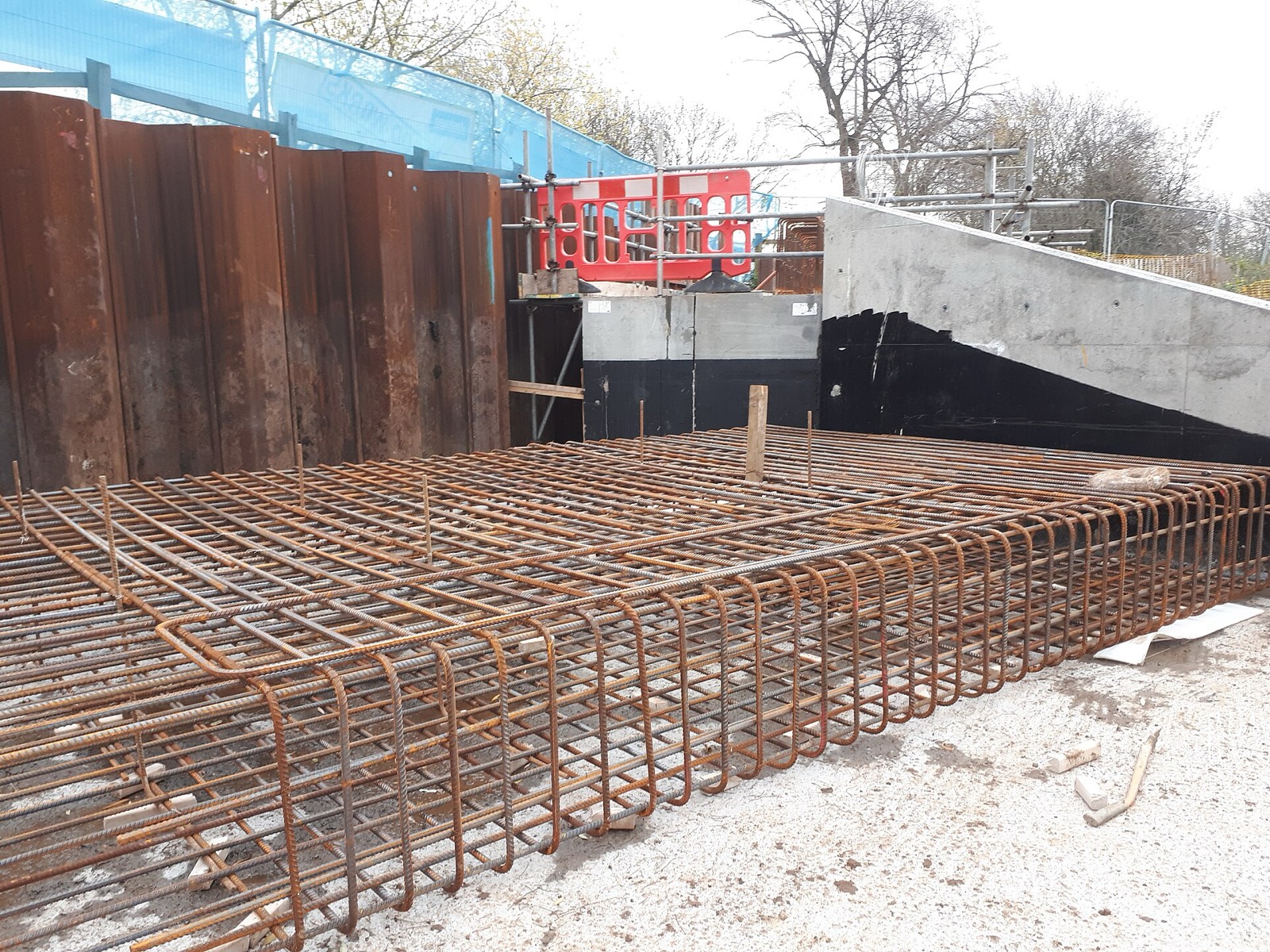 A steel rebar grid laid out for a concrete slab